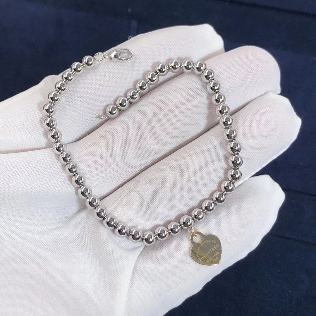 Браслет Tiffany с бусинами из белого золота 1